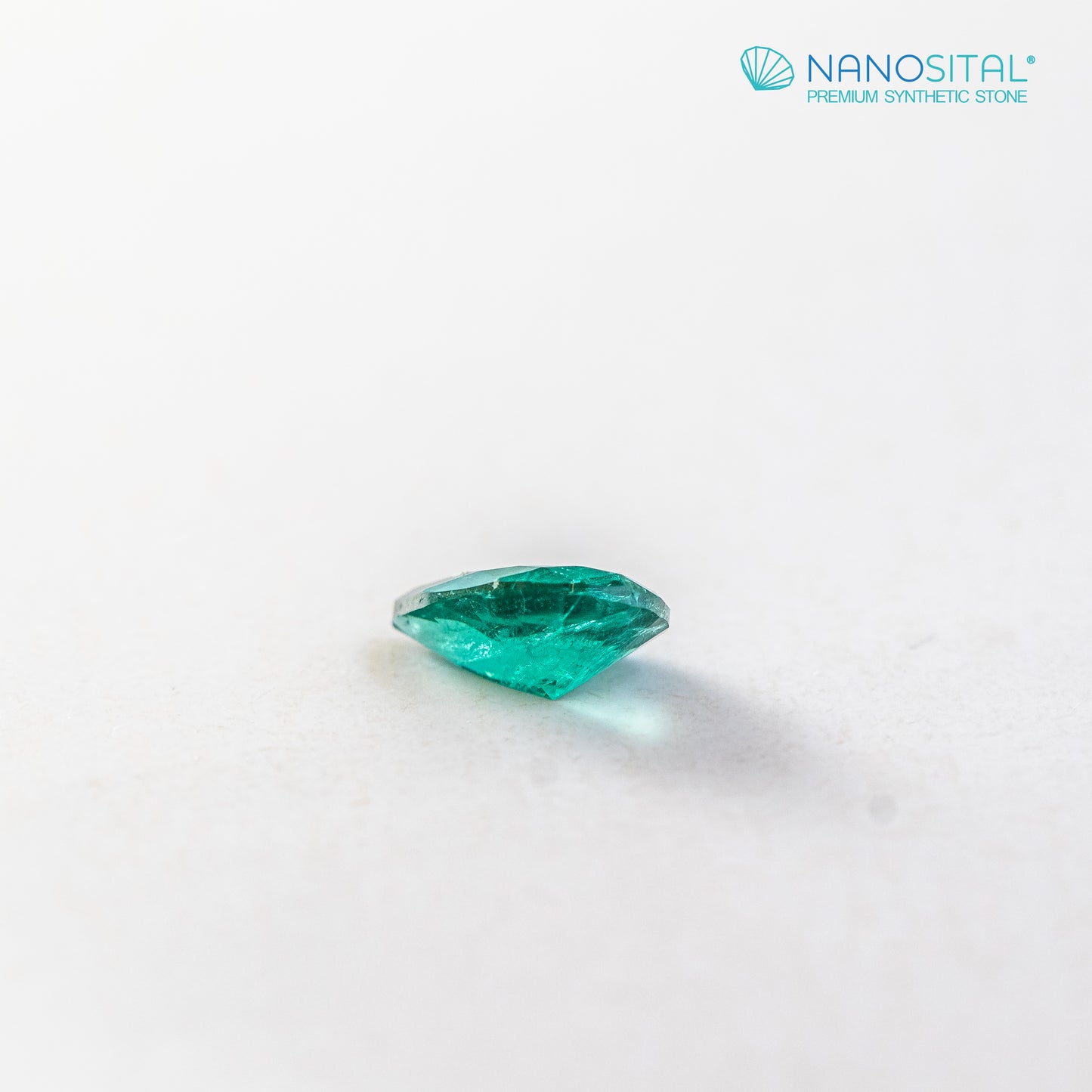 Nanosital #Z-22/B Emerald bluish with inclusions Pear 10*7 mm